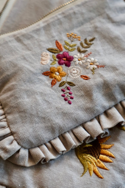 Embroidered ruffle pouch